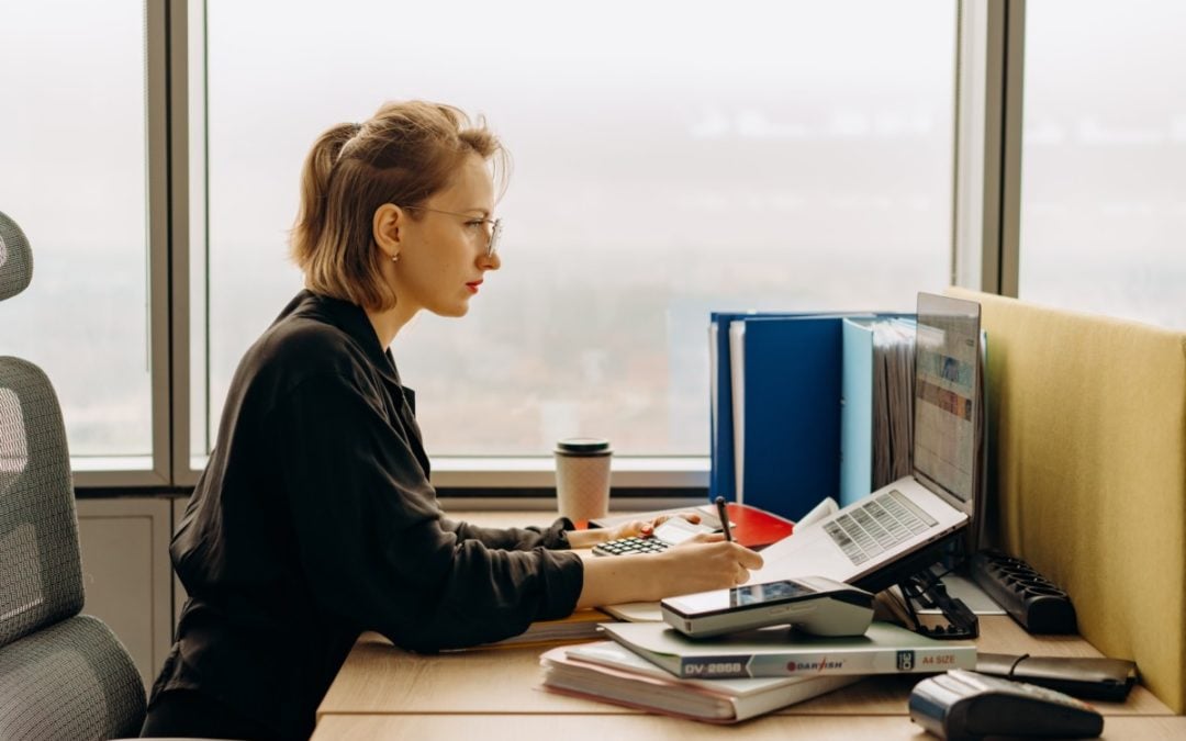 woman working on computer at desk