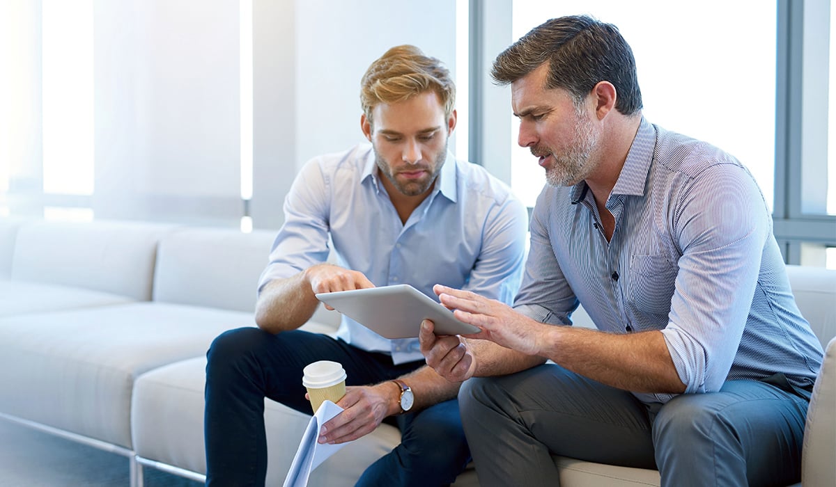 Business man discussing digital tablet with