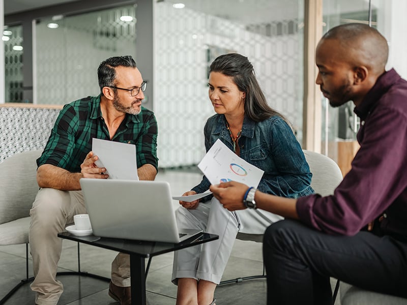 Group of business people analyzing finances